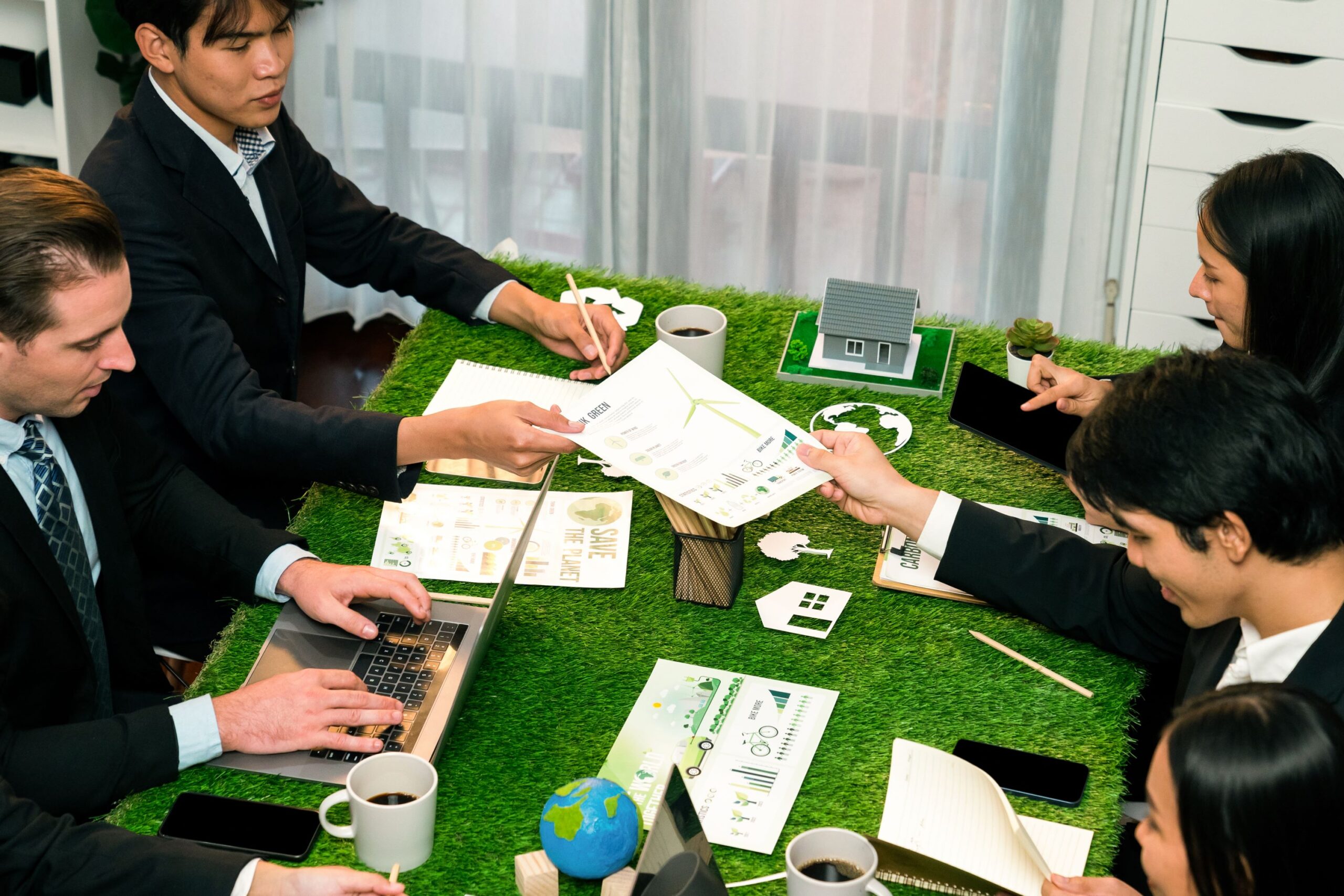 Diverse group of business people planning business marketing with environmental responsibility for greener ecology. Productive teamwork contribute natural preservation and sustainable future. Quaint