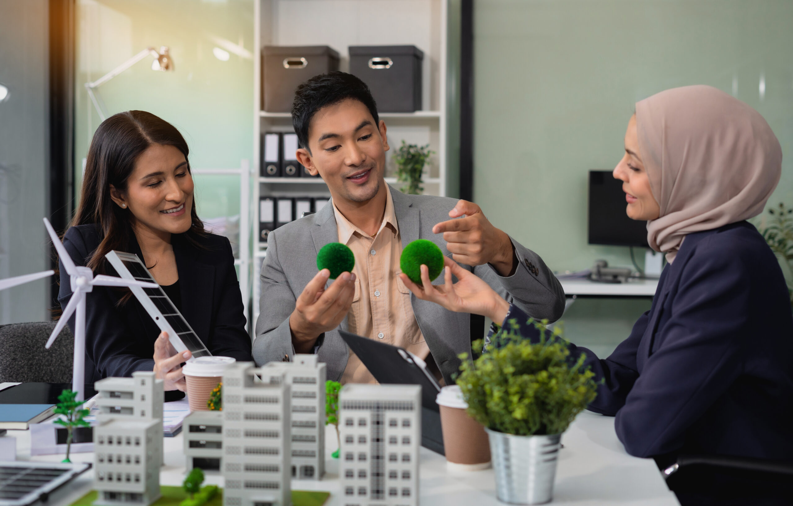Engineer Teamwork Meeting, with partner on model building at company office working technology, Renewable energy-based green businesses and global warming.