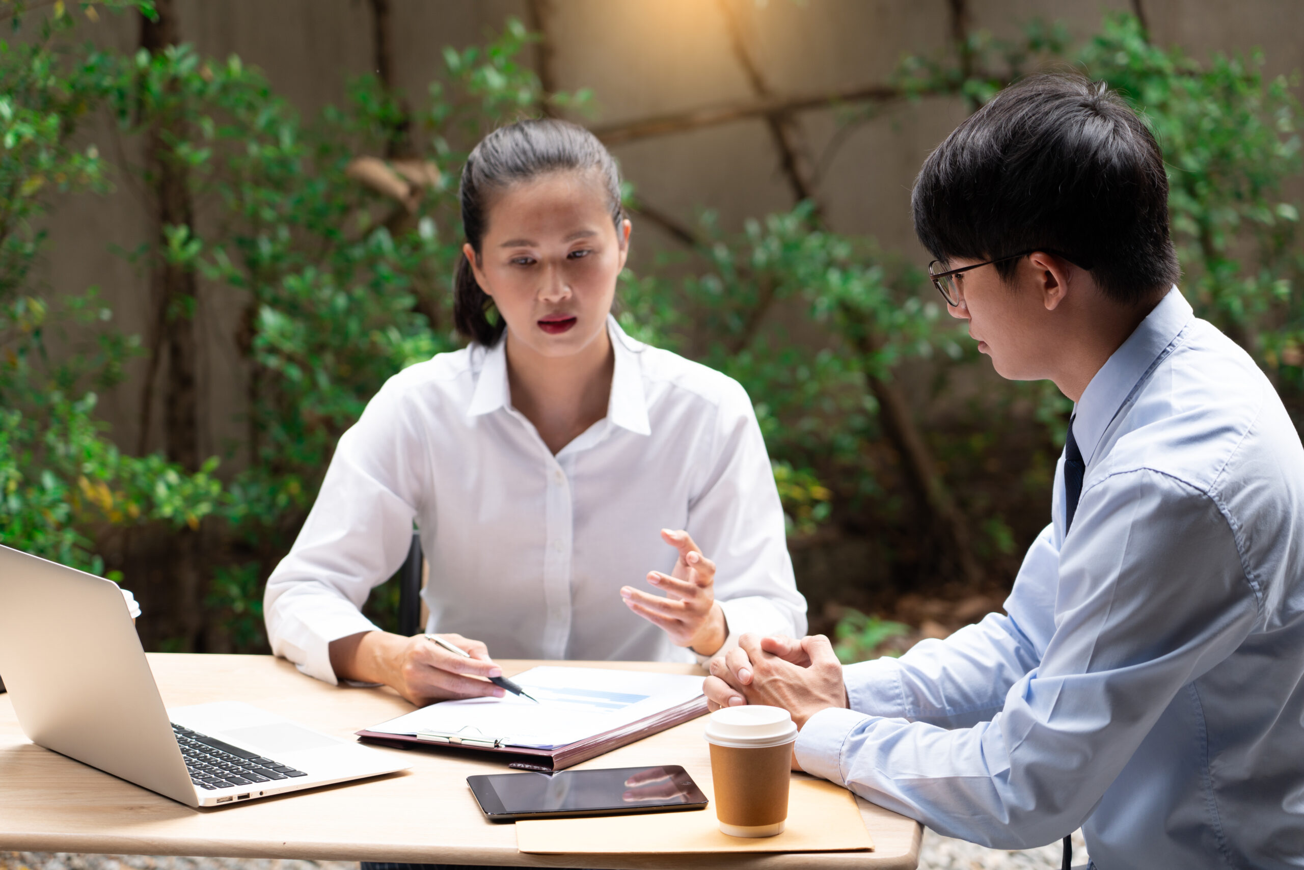business people talking during break discussing new project business outside office in the city.