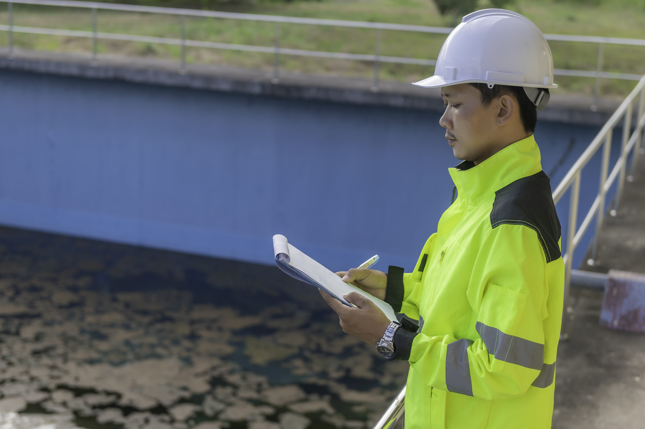 Environmental engineers work at wastewater treatment plants,Water supply engineering working at Water recycling plant for reuse