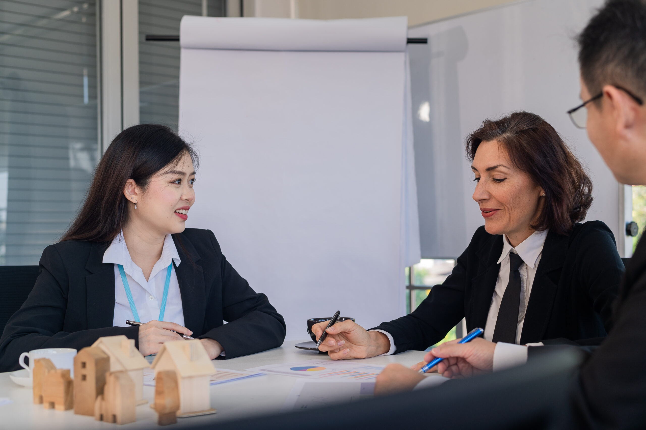 Marketing team meeting to plan business for sale of housing projects and real estate