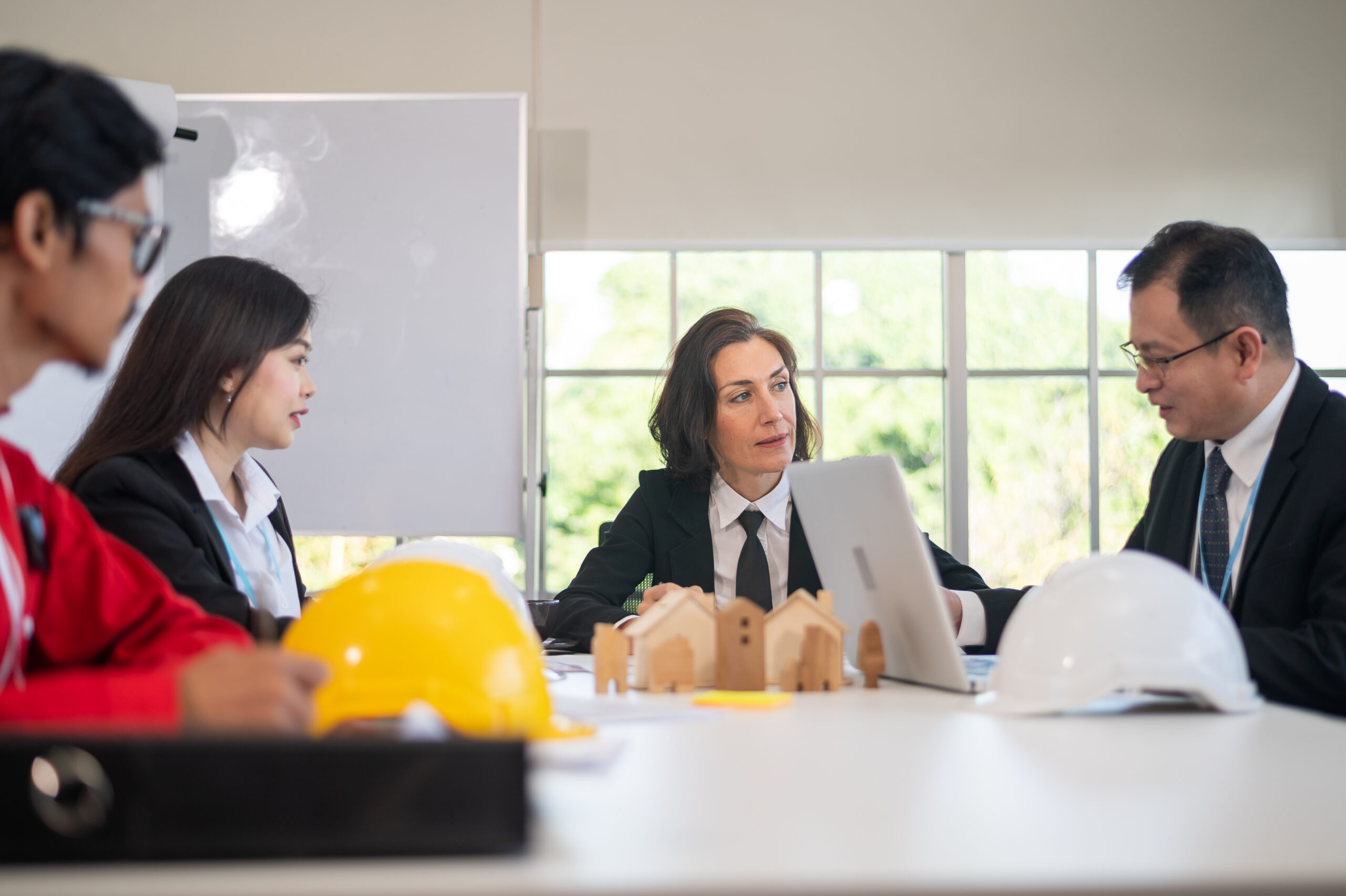 Business team and Engineer Architecture talking in meeting plan construction project